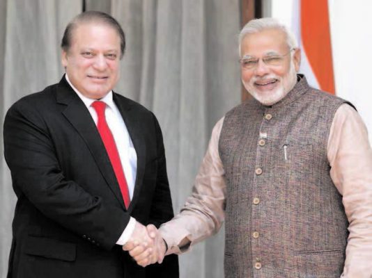 Does this handshake mean anything? Pakistan Prime Minister Nawaz Sharif (left) and India's Prime Minister Narendra Modi in New Delhi