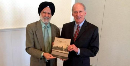 Dr. Hardarshan Singh Valia presenting his book entitled "Indiana Coals and the Steel Industry" to Indiana Senator Dan Coats
