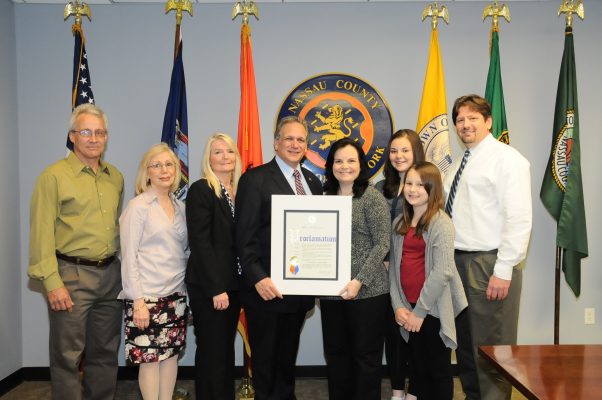Mangano proclaims May Syringomyelia Awareness Month. Pictured (left to right): John Caemmerer, ASAP Board of Directors; ASAP Member Maureen Routledge; Patrice Schaublin, President Board of Directors; County Executive Ed Mangano; Shananne Hutter, LI-NY ASAP Support Group Leader, along with her family Katie, Sara and Stephen Hutter.