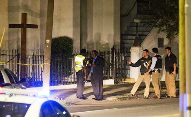 Police stand outside the Emanuel AME Church following a shooting on June 17, 2015, in Charleston, South Carolina. (Associated Press photo)