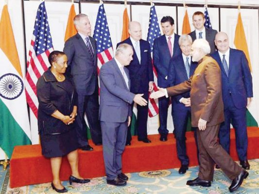 Prime Minister Narendra Modi with officials of top Financial institutions before a meeting with them in New York on Thursday, September 24