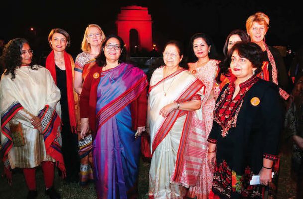 'Orange the World' kicks off in India with illumination of the iconic monument India Gate in orange. Delegates with the Lok Sabha Speaker Sumitra Mahajan in the backdrop of India Gate (Photo/ courtesy UN Women)