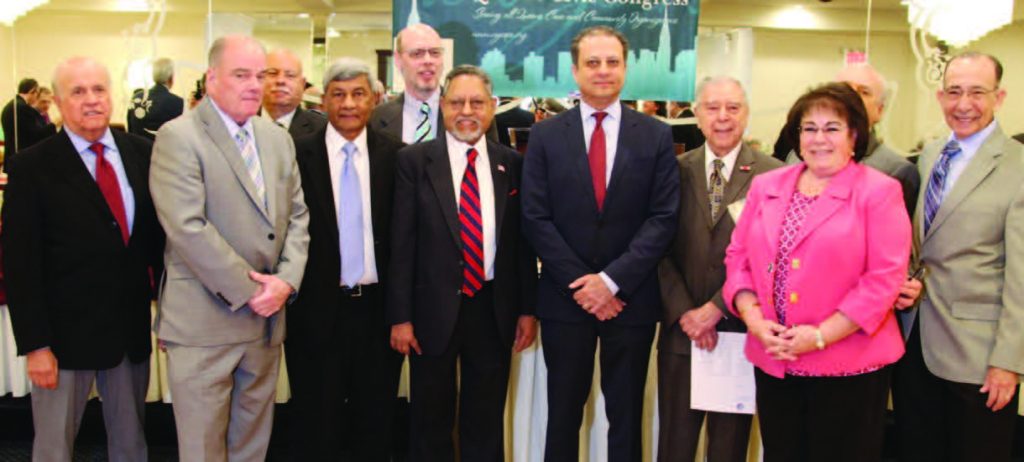 Keynote speaker Preet Bharara seen with officials of QCC