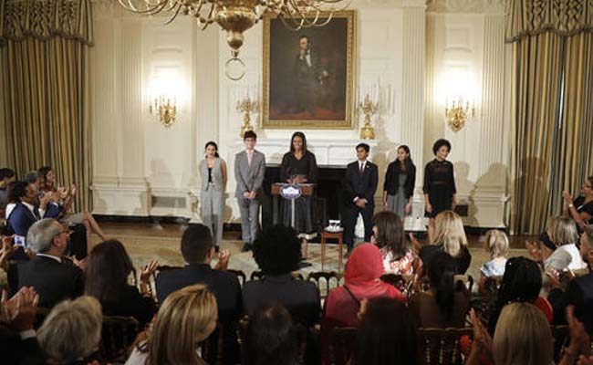 Michelle Obama with Maya Salameh, Joey Reisberg, Gopal Raman (second from r) and Maya Eashwaran (r). (AP)