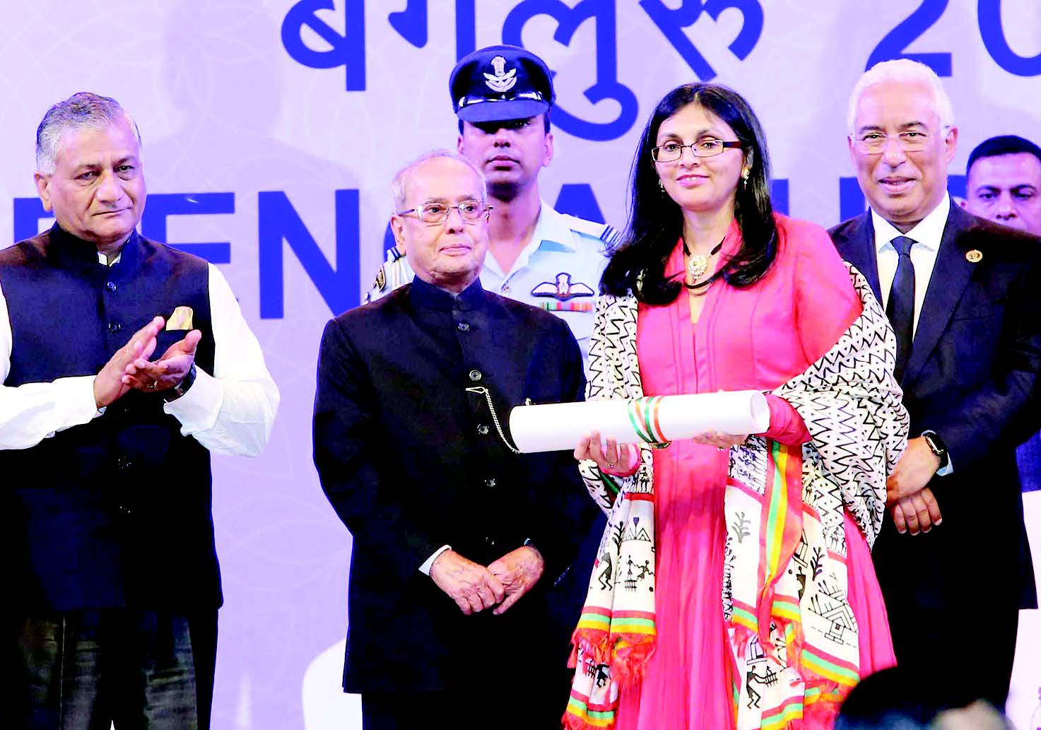 President Pranab Mukherjee conferred Pravasi Bharatiya Samman on Nisha Desai Biswal, US Assistant Secretary of State. Seen in the picture, from L to R: General VK Singh, Minister of State for External affairs, President Pranab Mukherjee, Nisha Desai Biswal with her honor scroll and Luiss Da Costa, Prime Minister of Portugal who was also conferred the honor. Photo/Jay Mandal on assignment