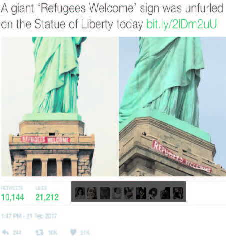 Refugees Welcome' Banner on Statue of Liberty