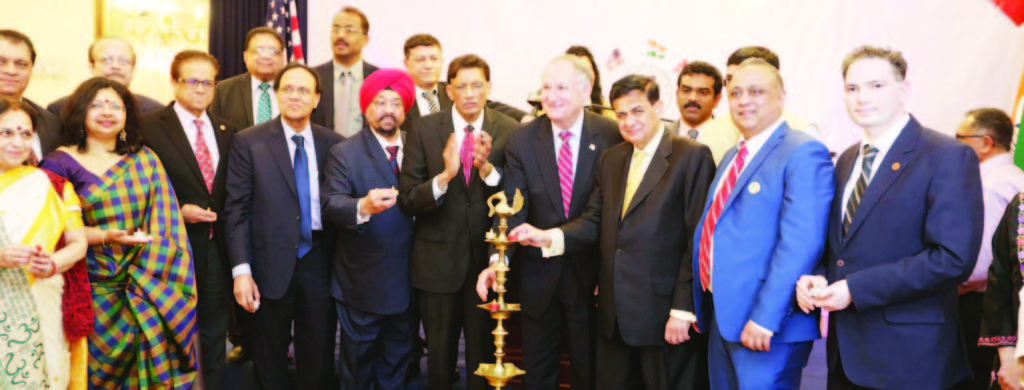 Lighting the lamp to inaugurate the event. From L to R: Purnima Desai, Rajiv Bhambri, Vandana Sharma, Sudhir Vaishnav, Dr. VK Raju,, Peter Kothari, Dr. D. Nori, Biju Chacko, Prof. Indrajit S Saluja, Parveen Chopra, HR Shah, George Maragos, MC Sangeet Sharma (partially visible), Dr. Sudhir Parikh, Ginsmon Zacharia (partially visible) , Srujal Parikh Photo/ Mohammad Jaffer-SnapsIndia