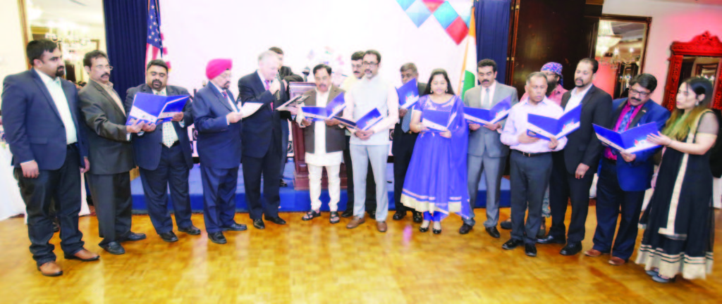 Nassau County Comptroller George Maragos administers oath of office to new Board of Directors led by Chairman Babu and Executive committee members, led by President Prof. Indrajit s Saluja