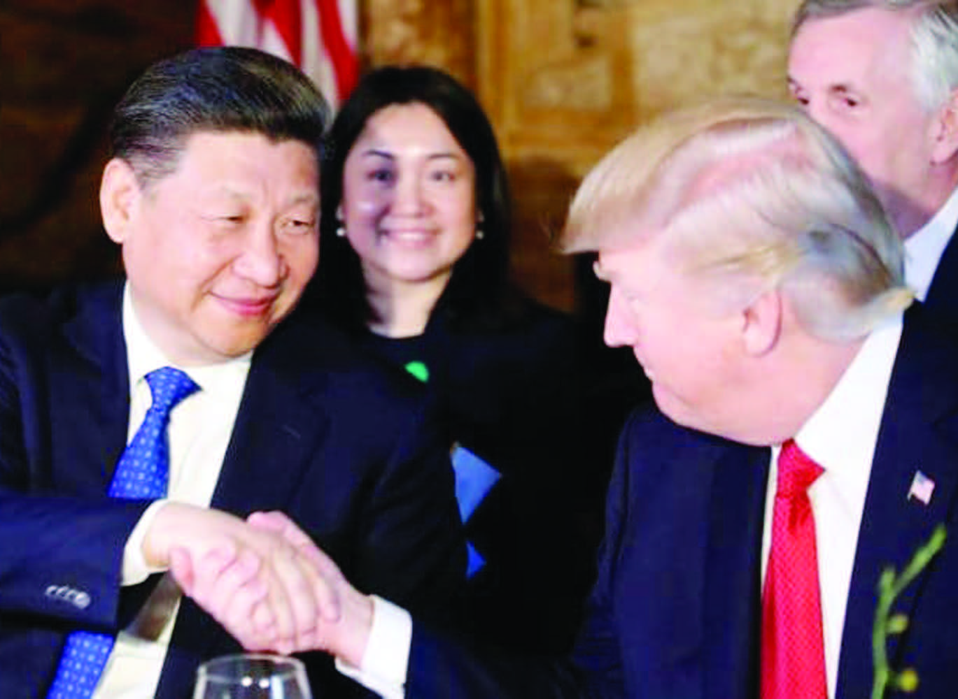 President Donald Trump and Chinese President Xi Jinping shake hands during a dinner at Mar-a-Lago