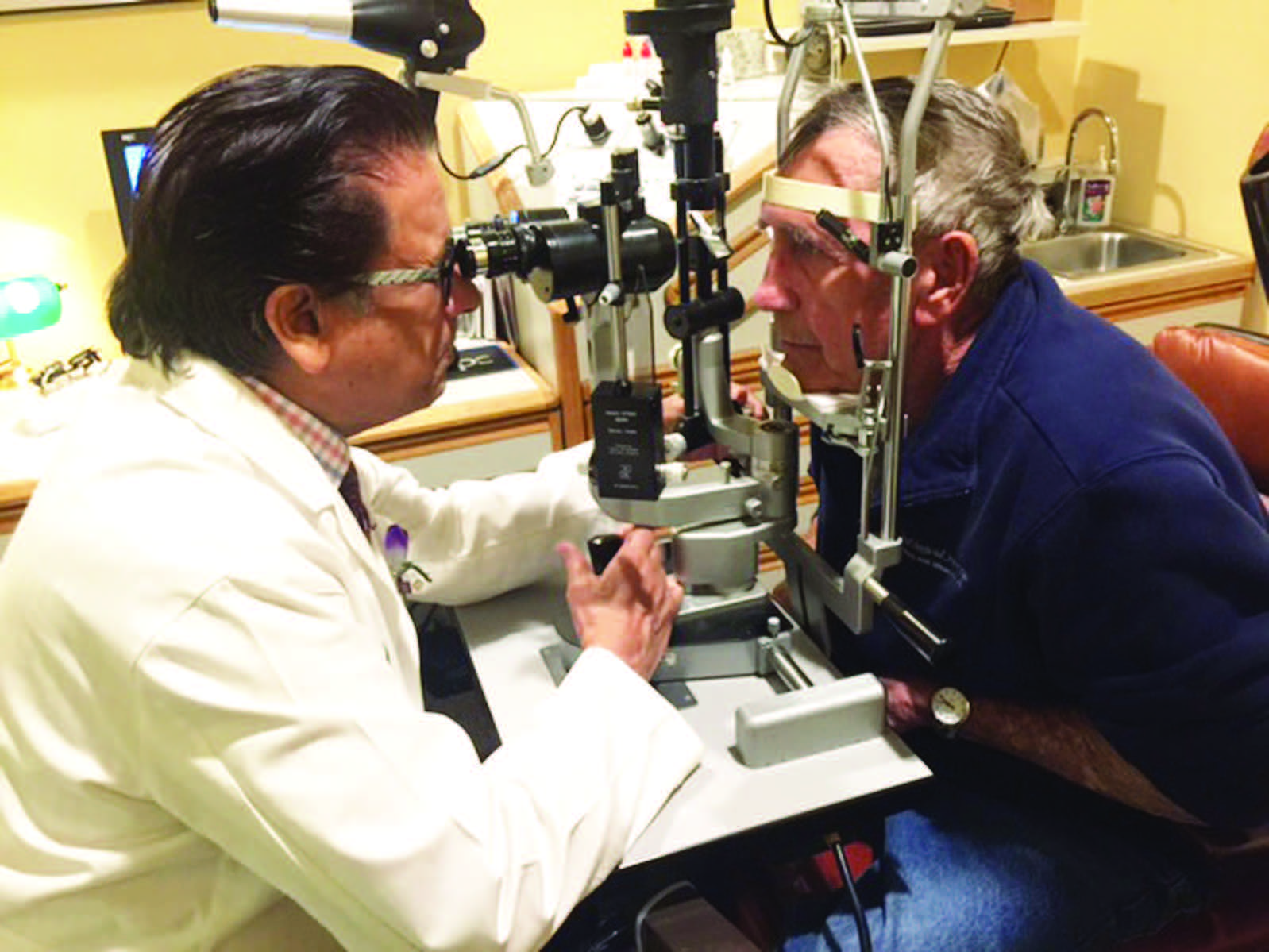 Dr. V. K. Raju examining a patient in his Morgantown clinic