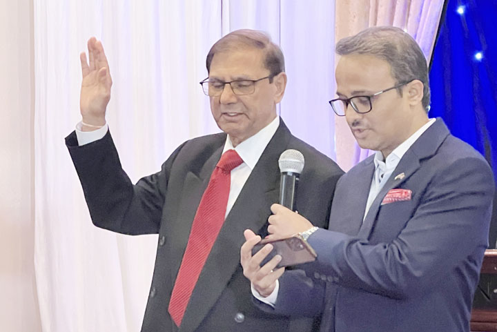 Consul General of India in New York Mr. Binaya Srikanta Pradhan administers the oath of office to Gobind Munjal as President of the national Executive Committee of the Association of Indians in America