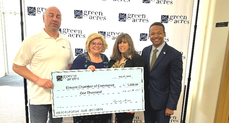 Green Acres Mall officials presented a $1,000 check in support of the Elmont Chamber of Commerce, and a $3,000 check for Simon’s Valley Stream Jazz Festival   (Credit: Office of Legislator Carrié Solages)